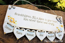 Load image into Gallery viewer, Grandchildren fill a place in your heart Plaque with hanging hearts
