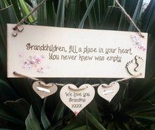 Load image into Gallery viewer, Grandchildren fill a place in your heart Plaque with hanging hearts

